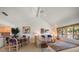 Bright living room featuring vaulted ceilings, adjacent dining area and natural light at 8003 Bardmoor Pl # 204, Seminole, FL 33777