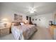 Cozy main bedroom features a ceiling fan, carpeted floors and neutral paint at 8003 Bardmoor Pl # 204, Seminole, FL 33777