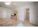 Bright main bedroom shows entry into a hallway closet and ensuite at 8003 Bardmoor Pl # 204, Seminole, FL 33777