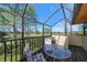 Screened patio featuring golf course views and outdoor seating at 8003 Bardmoor Pl # 204, Seminole, FL 33777