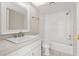 Bathroom featuring a white vanity, tiled floor, and shower/tub combo at 8141 Aquila St # 322, Port Richey, FL 34668