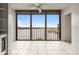 Bright enclosed lanai boasts tiled floors and panoramic water views, creating a serene indoor-outdoor living space at 8141 Aquila St # 322, Port Richey, FL 34668