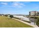 Manicured grounds offer a tranquil setting with lush greenery and scenic waterway views from the complex at 8141 Aquila St # 322, Port Richey, FL 34668