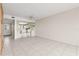 Open living room and breakfast bar with two stools are perfect for casual dining and entertaining at 8141 Aquila St # 322, Port Richey, FL 34668