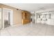 Spacious living room featuring tile floors and a large hutch for elegant storage solutions at 8141 Aquila St # 322, Port Richey, FL 34668