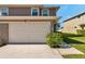 View of a two-car garage on a two-story townhome at 8221 118Th Ave, Largo, FL 33773