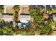 Aerial view of the property showcasing the home, pool, backyard, and surrounding neighborhood at 9618 N 55Th St, Temple Terrace, FL 33617