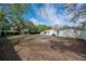 Spacious backyard with mature trees, providing shade and privacy for outdoor enjoyment at 9618 N 55Th St, Temple Terrace, FL 33617