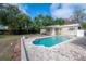 Backyard features a private pool, brick patio and garage, perfect for outdoor activities and entertainment at 9618 N 55Th St, Temple Terrace, FL 33617