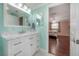 Stylish bathroom featuring marble countertops and an open view to bedroom at 9618 N 55Th St, Temple Terrace, FL 33617