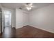 Bedroom featuring hardwood floors, a ceiling fan, and closet at 9618 N 55Th St, Temple Terrace, FL 33617