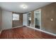 Spacious bedroom with wood floors, neutral walls, and closet access at 9618 N 55Th St, Temple Terrace, FL 33617