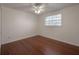 Cozy bedroom with ceiling fan and hardwood flooring at 9618 N 55Th St, Temple Terrace, FL 33617