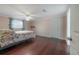 Spacious bedroom with hardwood floors, ceiling fan, and closet at 9618 N 55Th St, Temple Terrace, FL 33617