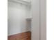 Walk-in closet with shelving, wood floor, and plenty of storage space at 9618 N 55Th St, Temple Terrace, FL 33617