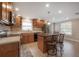 Open kitchen with stainless appliances, bar seating, and ample cabinetry at 9618 N 55Th St, Temple Terrace, FL 33617