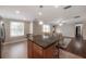 Kitchen island with breakfast bar, and view to living room at 9618 N 55Th St, Temple Terrace, FL 33617