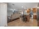 Open concept, spacious kitchen with an island bar, stainless steel appliances, and hardwood floors at 9618 N 55Th St, Temple Terrace, FL 33617