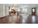 Spacious living room with hardwood floors, open to the kitchen at 9618 N 55Th St, Temple Terrace, FL 33617
