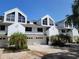 Attractive townhomes with attached garages and well-maintained landscaping at 9914 Indian Key Trl # 32, Seminole, FL 33776