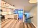 Modern kitchen with stainless steel appliances, an open layout, and seamless access to the living room at 9914 Indian Key Trl # 32, Seminole, FL 33776