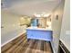 Updated kitchen with stainless steel appliances, island and seamless access to other rooms at 9914 Indian Key Trl # 32, Seminole, FL 33776