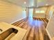 Bright living room featuring stylish floors and a doorway to the outdoor space at 9914 Indian Key Trl # 32, Seminole, FL 33776