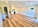 Open-concept living space with modern floors and kitchenette for comfortable living at 9914 Indian Key Trl # 32, Seminole, FL 33776