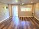 Spacious living room featuring sleek floors, a ceiling fan, and a bright, airy feel at 9914 Indian Key Trl # 32, Seminole, FL 33776