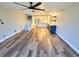 Open living room featuring hardwood floors, an open floor plan, and recessed lighting at 9914 Indian Key Trl # 32, Seminole, FL 33776