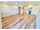 Bright living room features modern plank floors, mini bar, and lots of space at 9914 Indian Key Trl # 32, Seminole, FL 33776