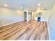 Spacious living room with plank flooring, mini bar, recessed lighting, and neutral paint at 9914 Indian Key Trl # 32, Seminole, FL 33776