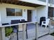 Cozy patio featuring comfortable seating, a grill, and access to the indoors at 9914 Indian Key Trl # 32, Seminole, FL 33776