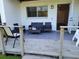 Outdoor patio area furnished with stylish seating and a view of the property at 9914 Indian Key Trl # 32, Seminole, FL 33776