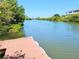 Scenic water view from the dock, showcasing the calm river and lush surroundings at 9914 Indian Key Trl # 32, Seminole, FL 33776