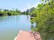 Scenic view of a wide waterway with docks and lush foliage at 9914 Indian Key Trl # 32, Seminole, FL 33776