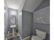 Powder room featuring pedestal sink, gray walls and modern lighting at 10112 Rose Petal Pl, Riverview, FL 33578