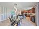 Open concept kitchen with island, granite countertops, and modern appliances at 10112 Rose Petal Pl, Riverview, FL 33578