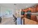 Eat-in kitchen with granite countertops, stainless steel appliances, and modern island at 10112 Rose Petal Pl, Riverview, FL 33578