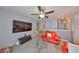 Upstairs living room with large TV and ceiling fan at 10112 Rose Petal Pl, Riverview, FL 33578