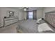 Relaxing main bedroom offers plush carpet, ceiling fan, dresser, and stylish bedframe with tufted headboard at 10112 Rose Petal Pl, Riverview, FL 33578