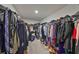 Walk-in closet with clothing racks, shelving, and ample storage for clothes, shoes, and accessories at 10112 Rose Petal Pl, Riverview, FL 33578