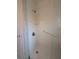 Clean bathroom featuring a walk-in shower, grab bar, and neutral-colored walls at 13913 Dominica Dr, Seminole, FL 33776