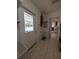 Laundry room with door leading to the pool area at 13913 Dominica Dr, Seminole, FL 33776