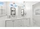 Elegant bathroom featuring double vanities with marble countertops and modern fixtures at 140 16Th Ne Ave, St Petersburg, FL 33704