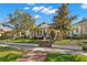 Charming home featuring a brick walkway, cozy front porch seating area, and well-maintained landscaping at 140 16Th Ne Ave, St Petersburg, FL 33704