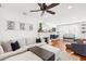 Comfortable living room featuring modern decor, a fireplace, and hardwood floors at 140 16Th Ne Ave, St Petersburg, FL 33704