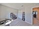 This bedroom provides ample storage with a spacious closet, along with unique decor for added appeal at 1407 Tropical Oasis Ave, Plant City, FL 33565