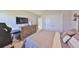 A carpeted bedroom offering a tv, storage, and a closet, perfect for relaxing and unwinding after a long day at 1407 Tropical Oasis Ave, Plant City, FL 33565