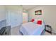 Comfortable bedroom with a double closet, plush bedding, and neutral walls at 1407 Tropical Oasis Ave, Plant City, FL 33565